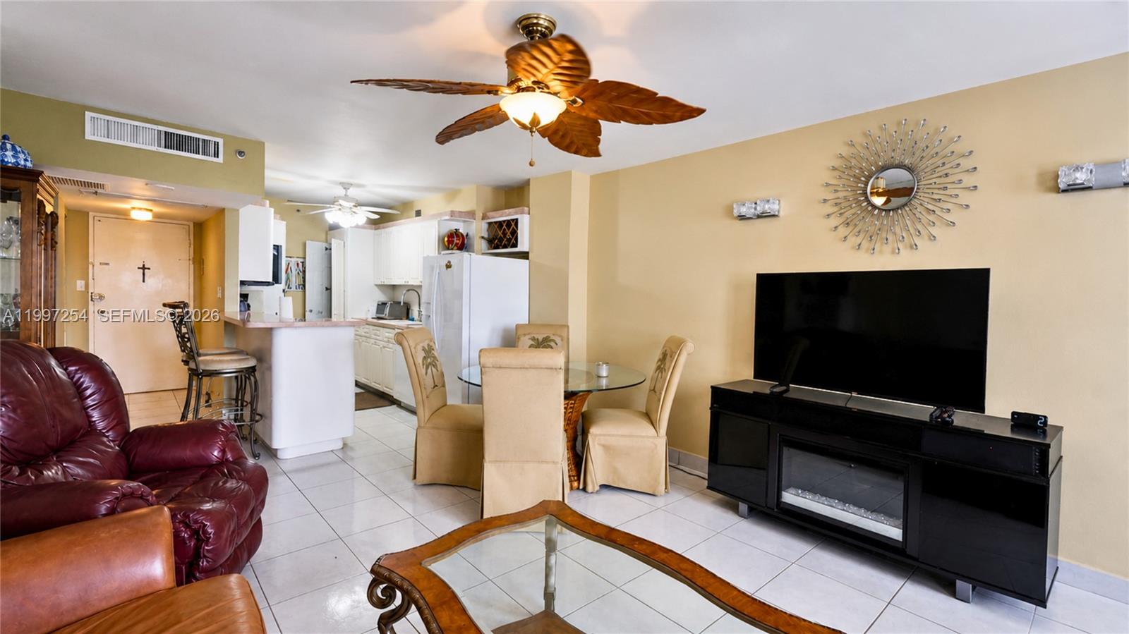 100 Lincoln Road, Unit 422 Miami Beach, FL 33139 - Photo 1 of 23 a living room with furniture and a flat screen tv