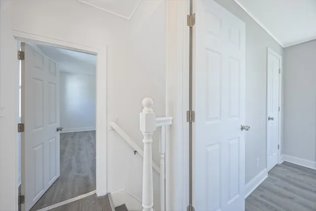 a view of a bathroom from a hallway