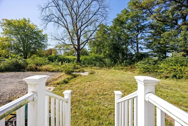 a view of a wooden fence and trees with wooden fence