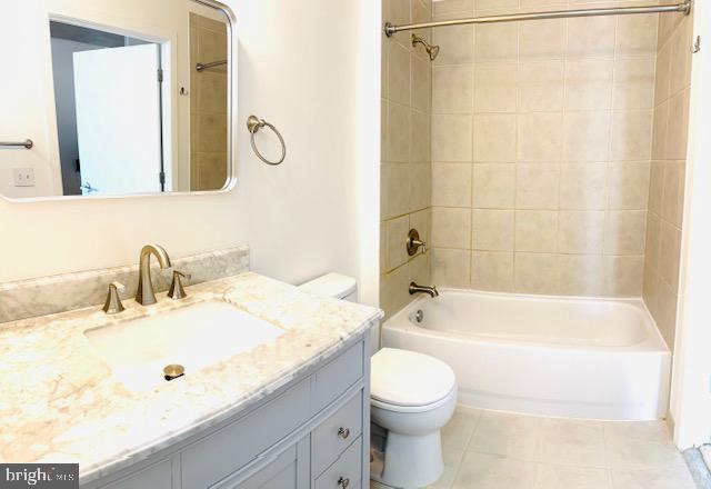2120 Vermont Avenue Northwest, Unit 207 Washington, DC 20001 - Photo 16 of 32 a bathroom with a granite countertop sink a toilet and bathtub