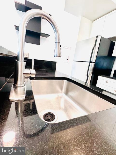 2120 Vermont Avenue Northwest, Unit 207 Washington, DC 20001 - Photo 21 of 32 a view of kitchen with a sink and microwave