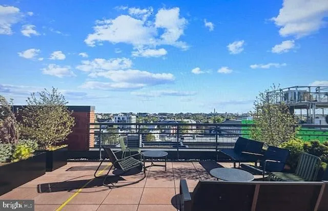 a view of a terrace with furniture