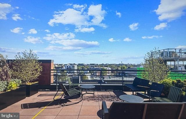 2120 Vermont Avenue Northwest, Unit 207 Washington, DC 20001 - Photo 22 of 32 a view of a terrace with lawn chairs