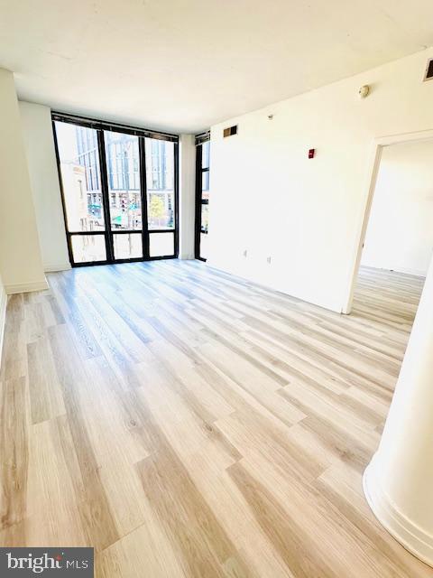 2120 Vermont Avenue Northwest, Unit 207 Washington, DC 20001 - Photo 3 of 32 a view of empty room with wooden floor