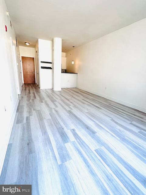 2120 Vermont Avenue Northwest, Unit 207 Washington, DC 20001 - Photo 9 of 32 a view of a kitchen with wooden floor