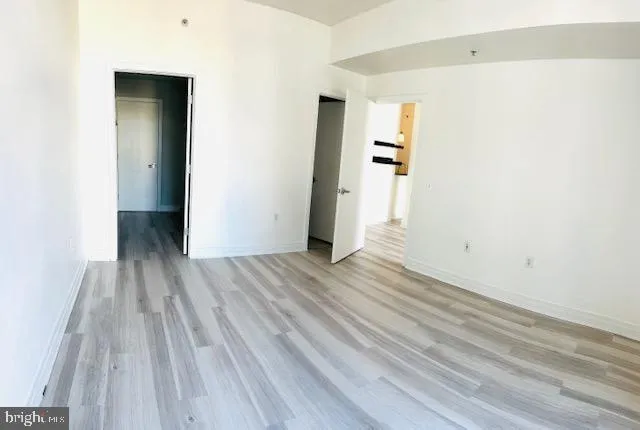 a view of a room with wooden floor and stairs