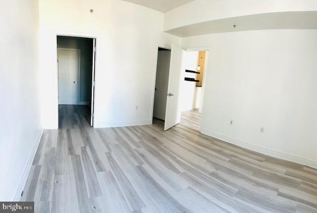 2120 Vermont Avenue Northwest, Unit 207 Washington, DC 20001 - Photo 10 of 32 a view of a room with wooden floor and stairs
