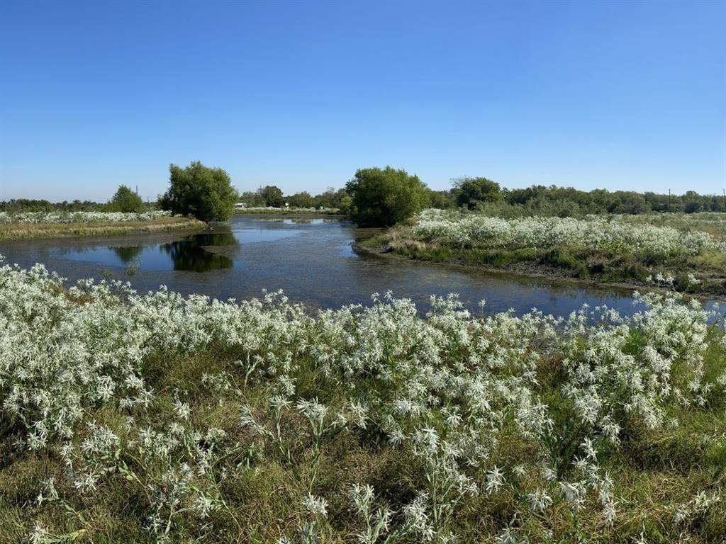 6096 Abner Road Kaufman, TX 75142 - Photo 14 of 20 a view of a lake with houses in the back