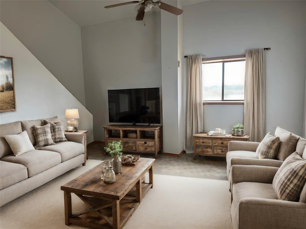 6096 Abner Road Kaufman, TX 75142 - Photo 9 of 20 a living room with furniture and a flat screen tv