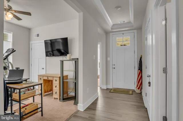 a view of a livingroom with furniture and a flat screen tv