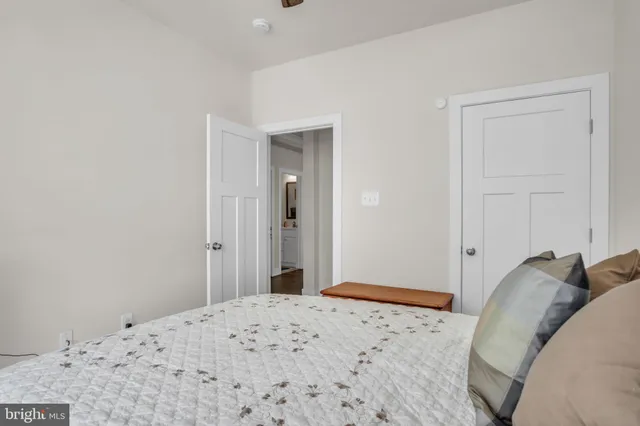 a bedroom with a bed and a closet