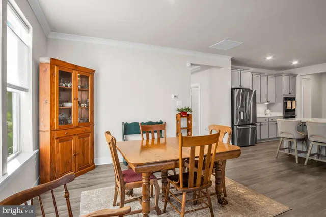 a dining room with furniture and window