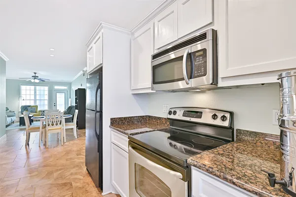 a kitchen with a stove and a microwave