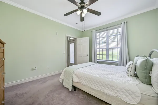 a bedroom with a bed and window