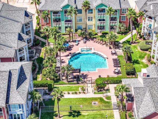 a view of building with outdoor space and swimming pool