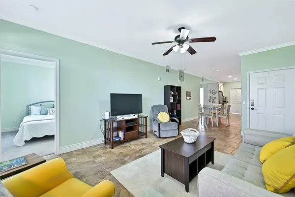 a living room with furniture and a flat screen tv