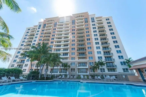 a front view of a building with swimming pool