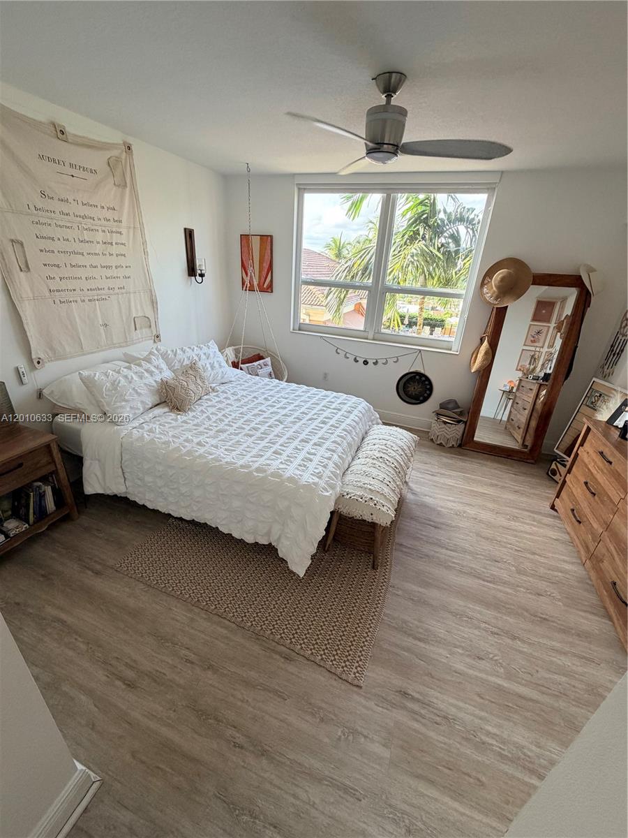 3232 Southwest 22nd Terrace, Unit 910 Miami, FL 33145 - Photo 11 of 31 a bedroom with a bed and a window