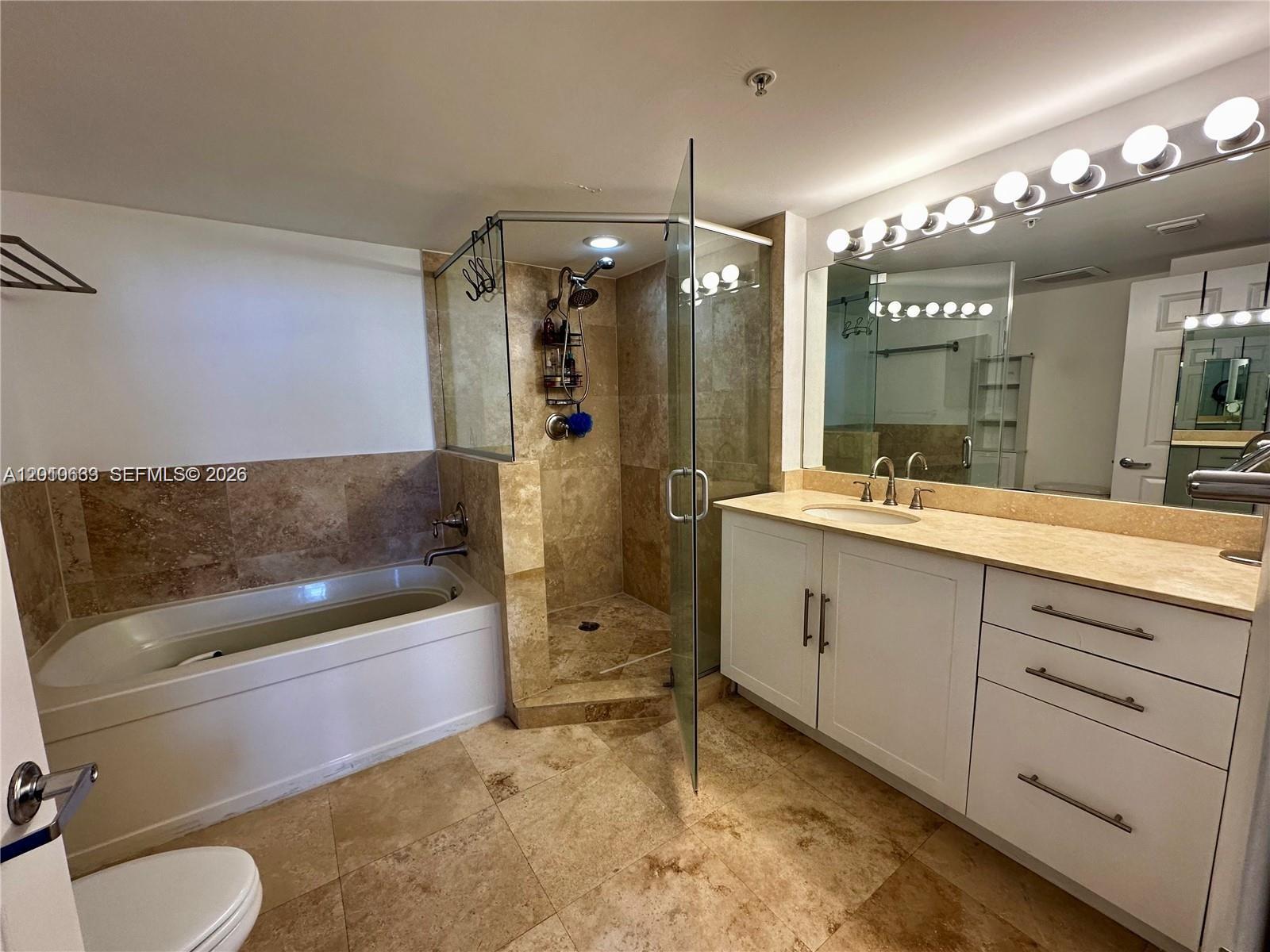 3232 Southwest 22nd Terrace, Unit 910 Miami, FL 33145 - Photo 13 of 31 a bathroom with a sink a toilet and shower