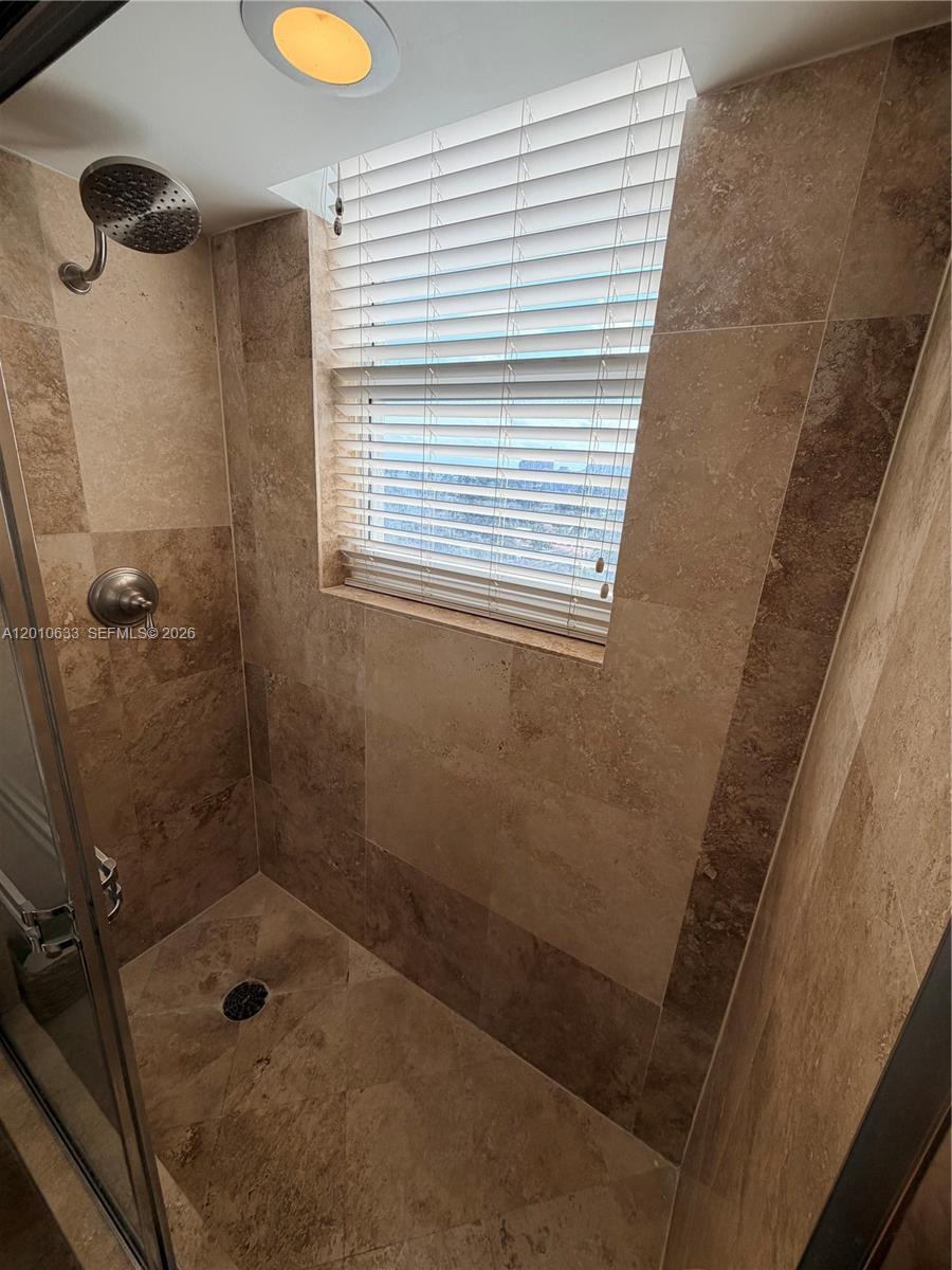 3232 Southwest 22nd Terrace, Unit 910 Miami, FL 33145 - Photo 18 of 31 a bathroom with a shower