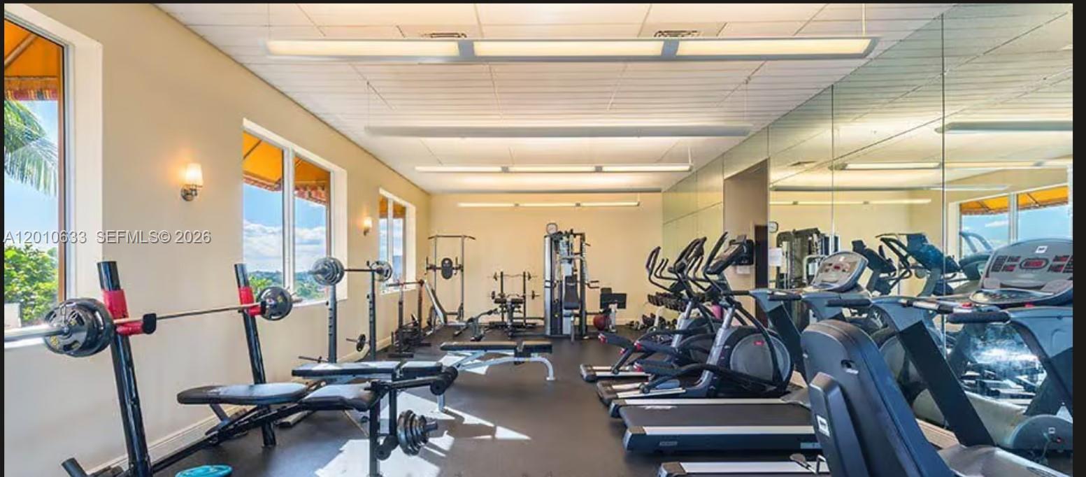 3232 Southwest 22nd Terrace, Unit 910 Miami, FL 33145 - Photo 26 of 31 a view of a room with gym equipment