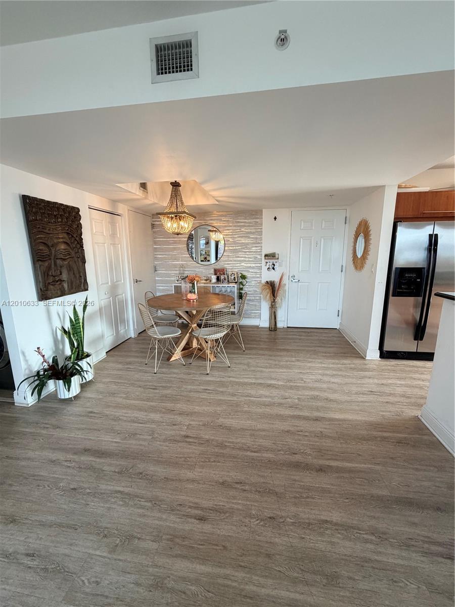 3232 Southwest 22nd Terrace, Unit 910 Miami, FL 33145 - Photo 6 of 31 a living room with furniture and wooden floor
