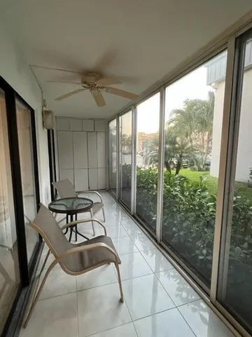 a room with patio outdoor view and wooden floor