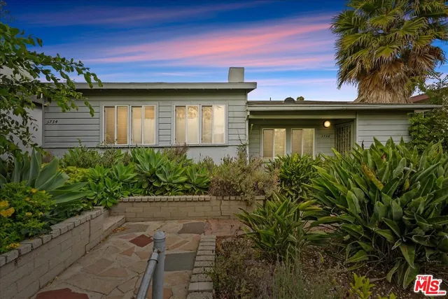 a house with a lot of plants