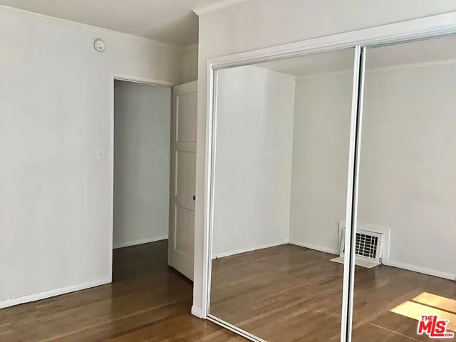 a white toilet sitting next to a bath tub