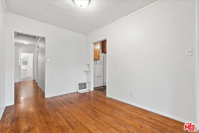 wooden floor in an empty room and a window