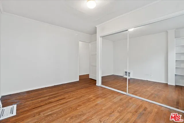 a bathroom with a sink and mirror with toilet