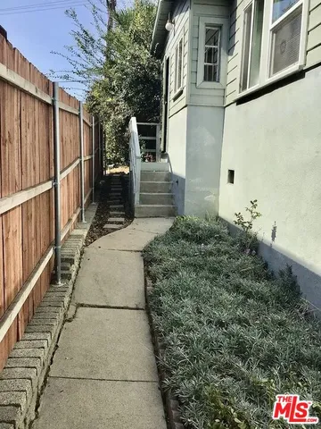 a balcony with table and chairs