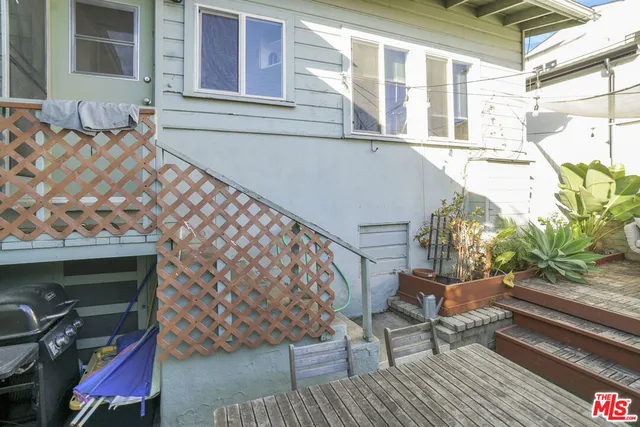 a view of a backyard with chairs