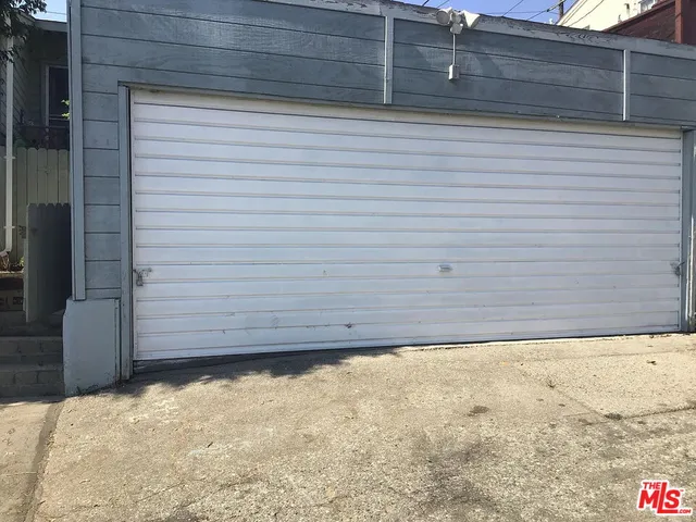 an aerial view of residential building with parking space