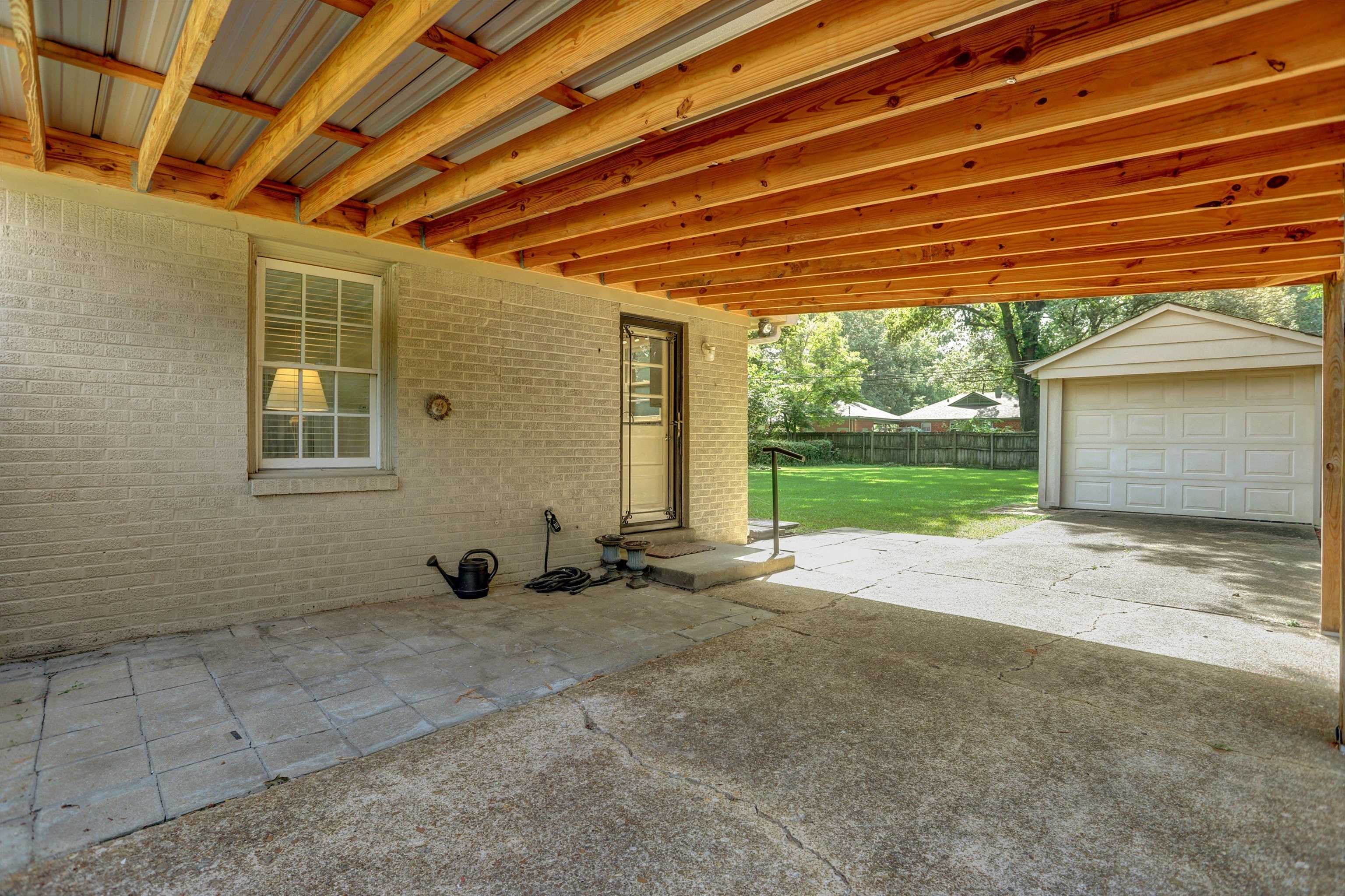 4545 Flamingo Road Memphis, TN 38117 - Photo 29 of 34 Covered patio area featuring a light-colored brick exterior