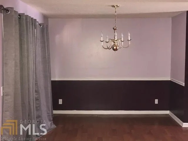 a kitchen with a refrigerator and a stove