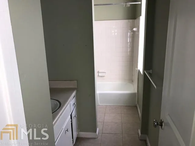 a bathroom with a sink and mirror