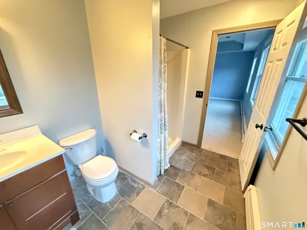a bathroom with a sink and toilet