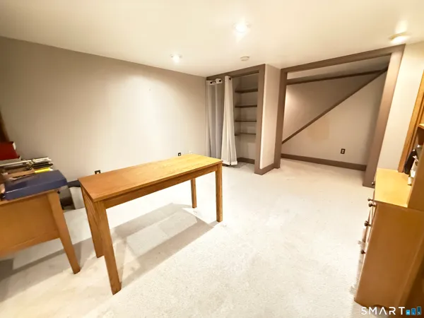 a view of balcony with wooden floor and fence