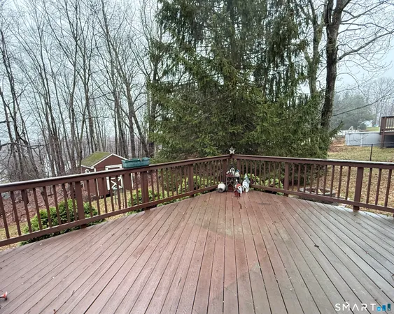 a backyard of a house with a yard and outdoor seating