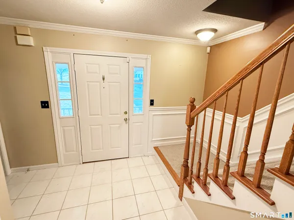 a view of an entryway with wooden floor