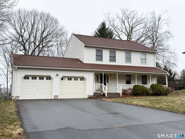 a view of a house with a backyard