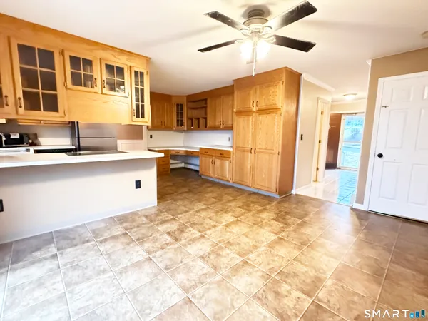 a view of a kitchen with a sink and cabinets