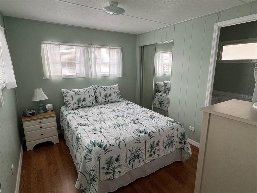 44 Thatch Palm Street West Largo, FL 33770 - Photo 14 of 25 a bedroom with a bed and a window
