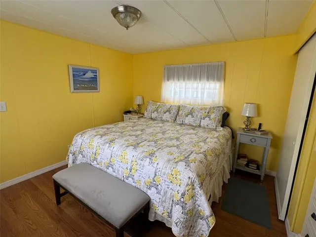 a bedroom with a bed and a lamp