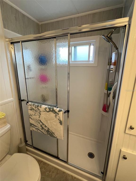 44 Thatch Palm Street West Largo, FL 33770 - Photo 24 of 25 a bathroom with a granite countertop sink toilet and shower