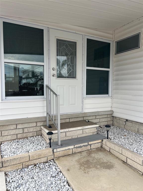 44 Thatch Palm Street West Largo, FL 33770 - Photo 3 of 25 a view of a house with a door and wooden floor