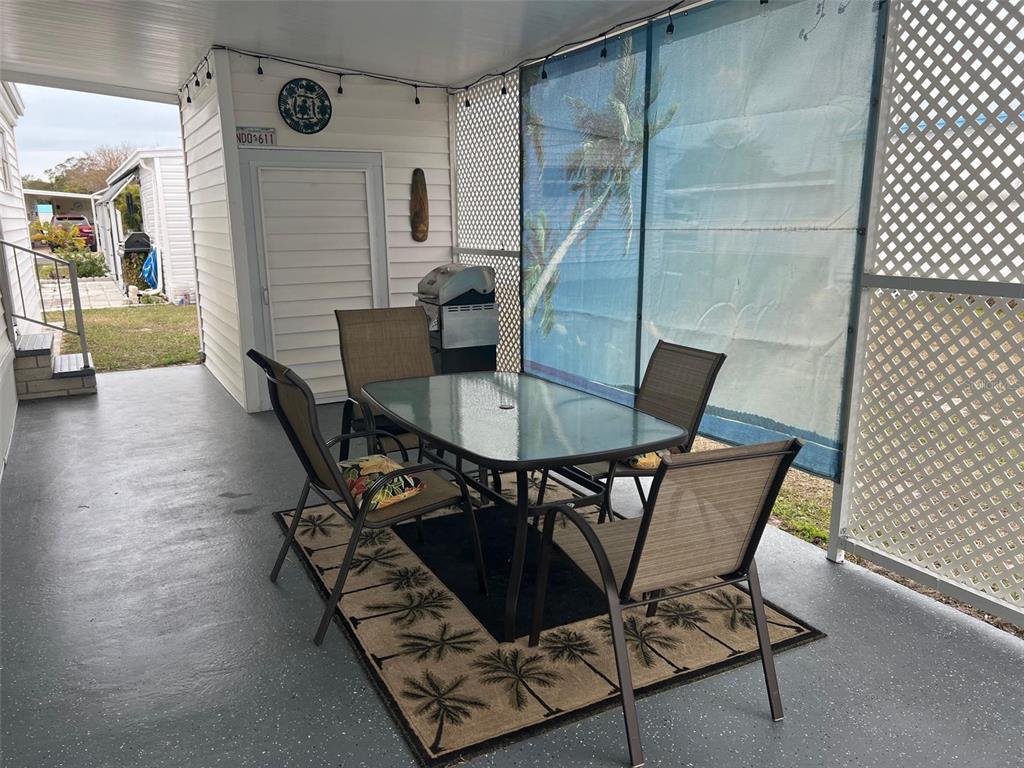 44 Thatch Palm Street West Largo, FL 33770 - Photo 4 of 25 a view of a dining room with furniture and wooden floor