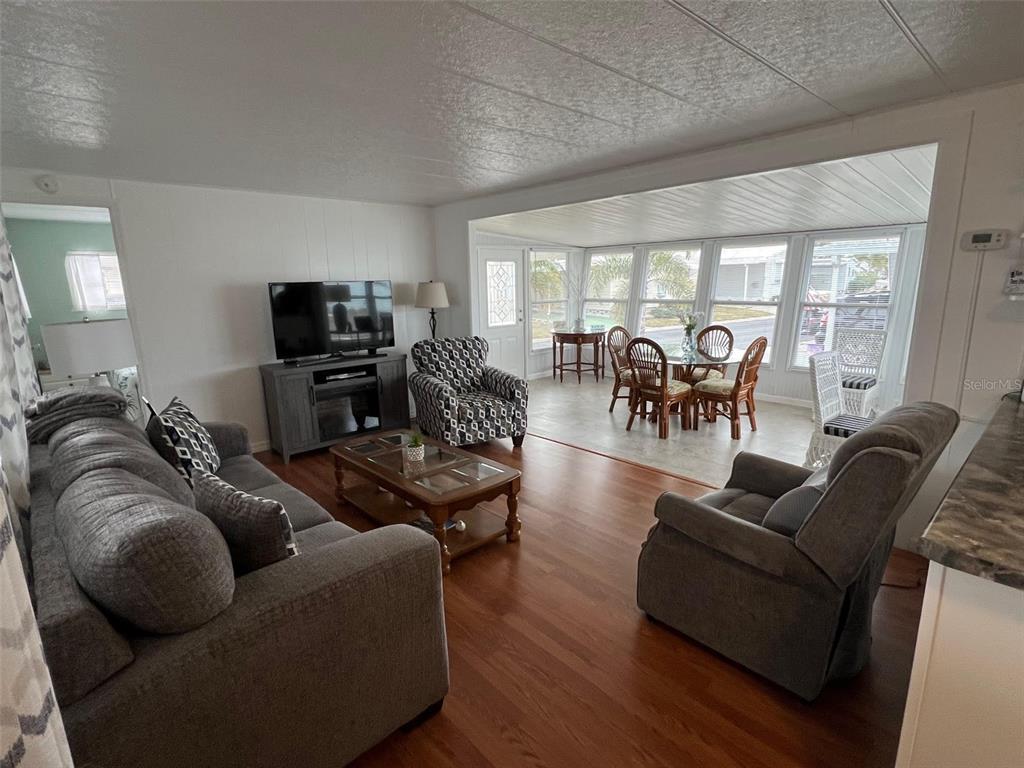 44 Thatch Palm Street West Largo, FL 33770 - Photo 8 of 25 a living room with furniture and a flat screen tv