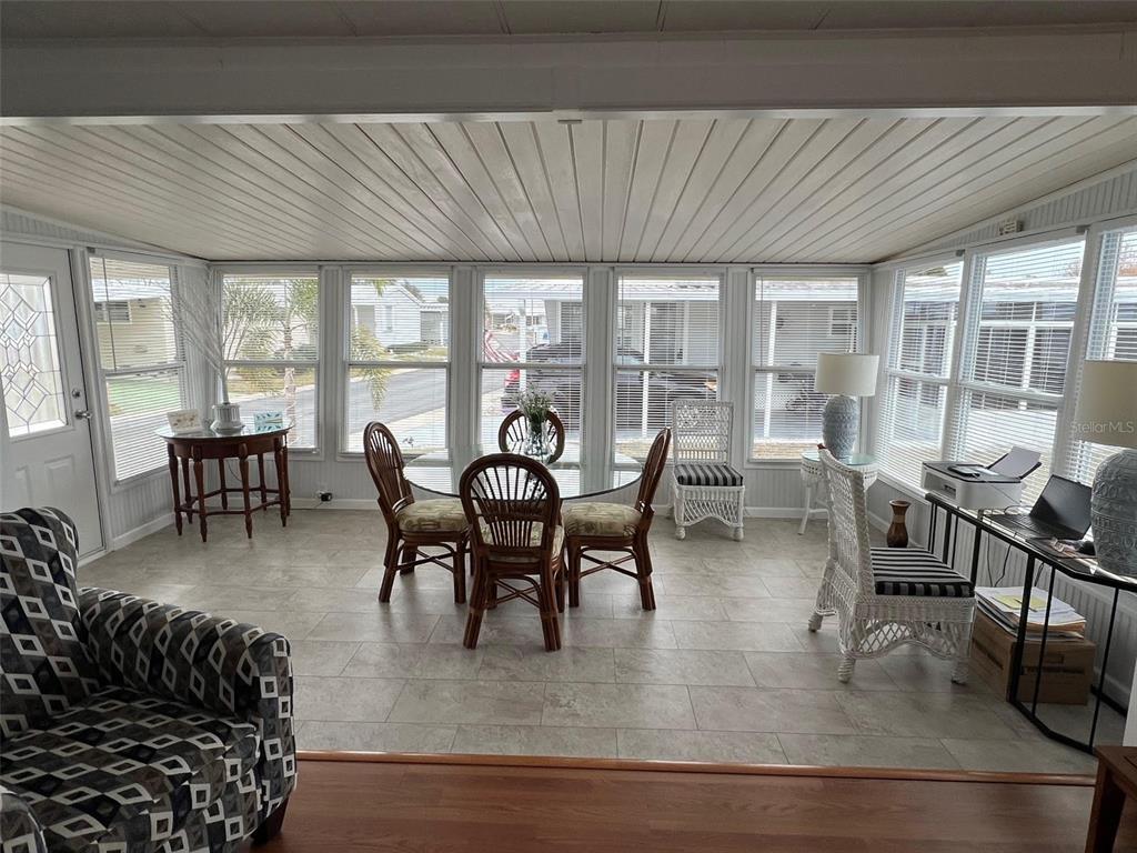 44 Thatch Palm Street West Largo, FL 33770 - Photo 10 of 25 a view of a dining room with furniture window and outside view